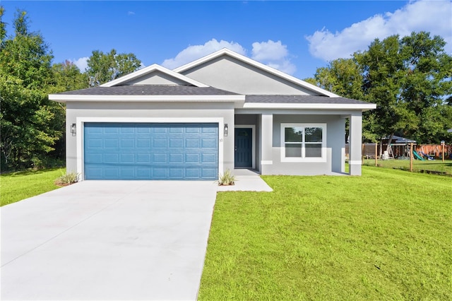 view of front facade with a front yard, a garage, and a playground