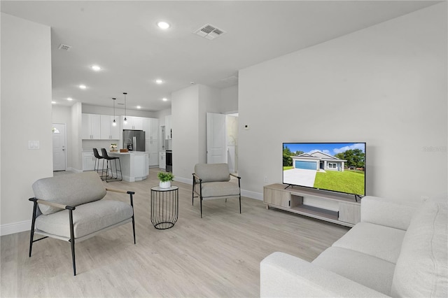 living room with light hardwood / wood-style floors