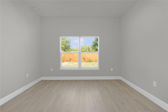 spare room featuring light hardwood / wood-style flooring