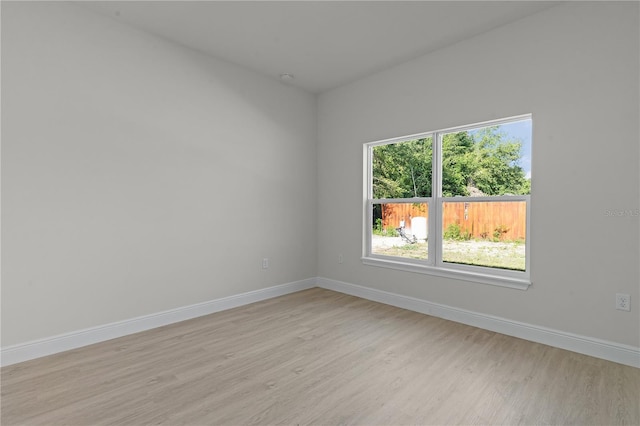 spare room featuring light hardwood / wood-style floors