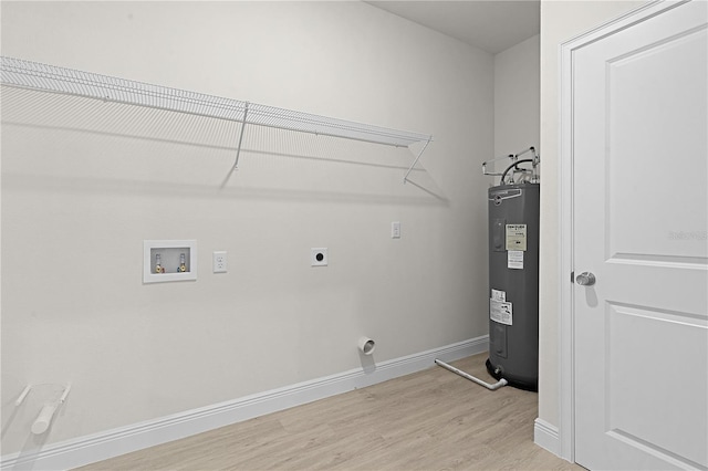 clothes washing area featuring water heater, light hardwood / wood-style flooring, hookup for a washing machine, and hookup for an electric dryer