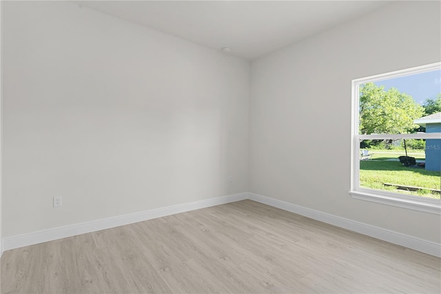 spare room with light hardwood / wood-style floors