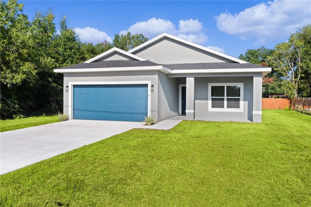 ranch-style house featuring a garage and a front yard