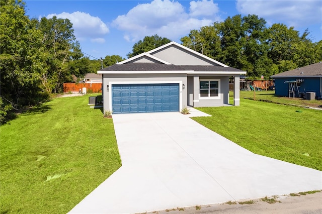 ranch-style home featuring a garage and a front lawn