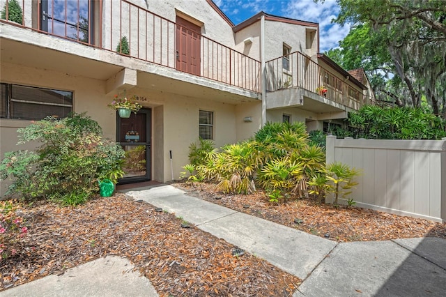 entrance to property featuring a balcony