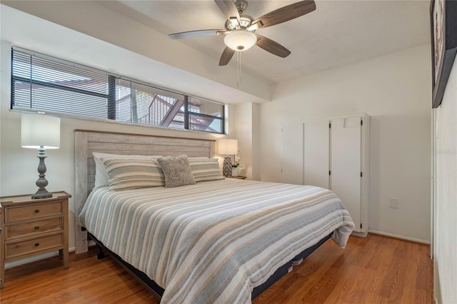 bedroom featuring ceiling fan and light wood-type flooring