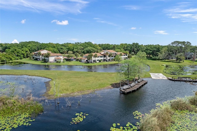 exterior space featuring a water view and a yard