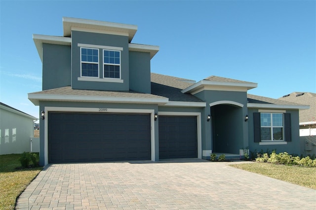 view of front of property with a garage