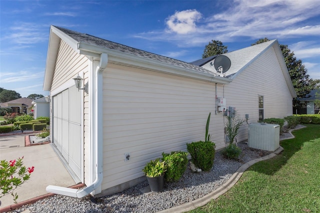 view of side of property with central AC unit