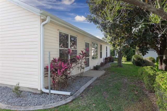 view of property exterior featuring a yard