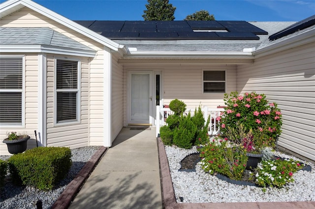 property entrance featuring solar panels