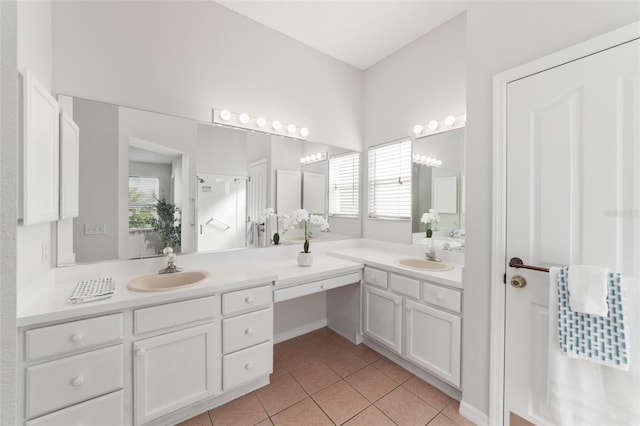 bathroom featuring plenty of natural light, vanity, and tile patterned flooring