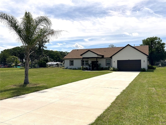 view of front facade featuring a front yard and a garage