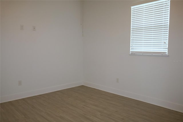 empty room featuring dark hardwood / wood-style flooring