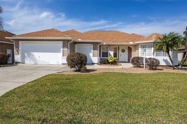 single story home featuring a front yard and a garage