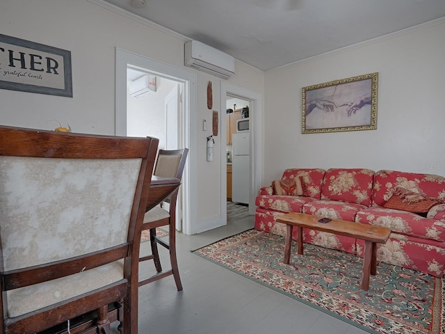 living room with hardwood / wood-style floors, ornamental molding, and a wall mounted AC