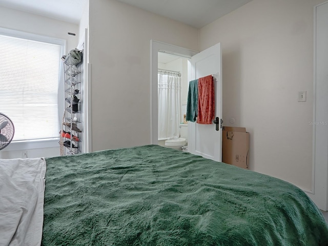 bedroom with carpet floors and multiple windows