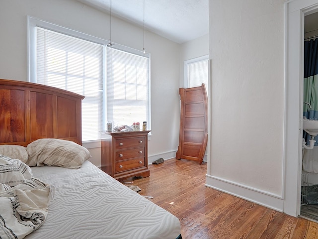 bedroom with hardwood / wood-style floors