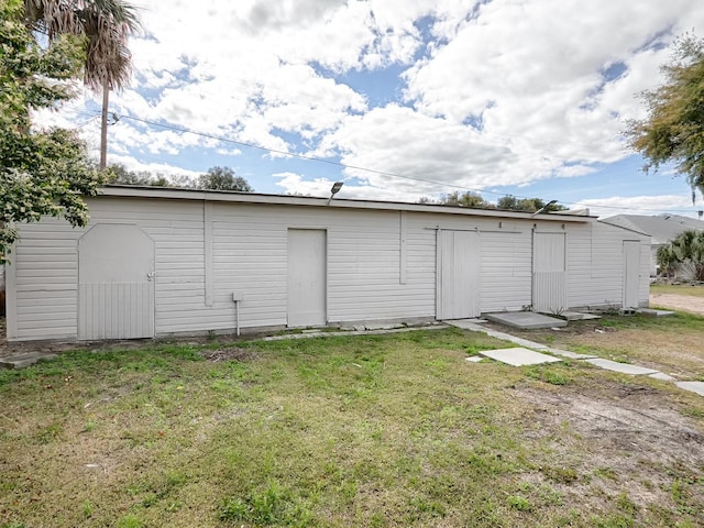 garage with a yard