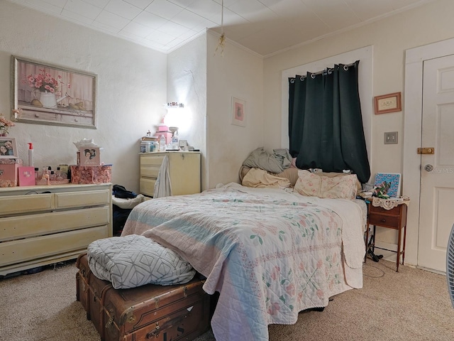 carpeted bedroom featuring ornamental molding