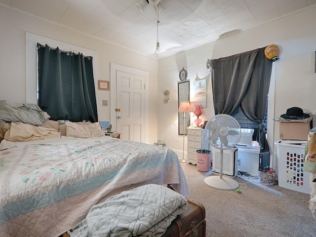 carpeted bedroom with crown molding