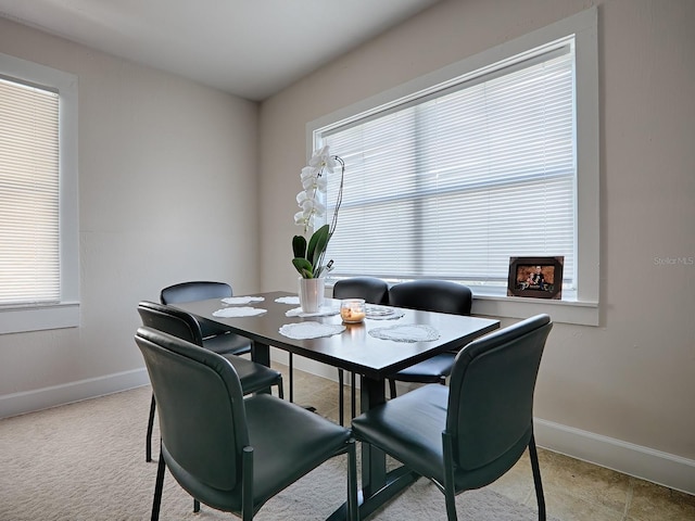 dining area featuring light tile flooring