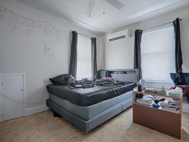 tiled bedroom with a wall mounted air conditioner and ceiling fan