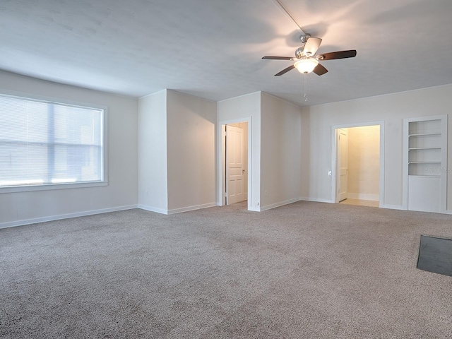 interior space with light colored carpet and ceiling fan