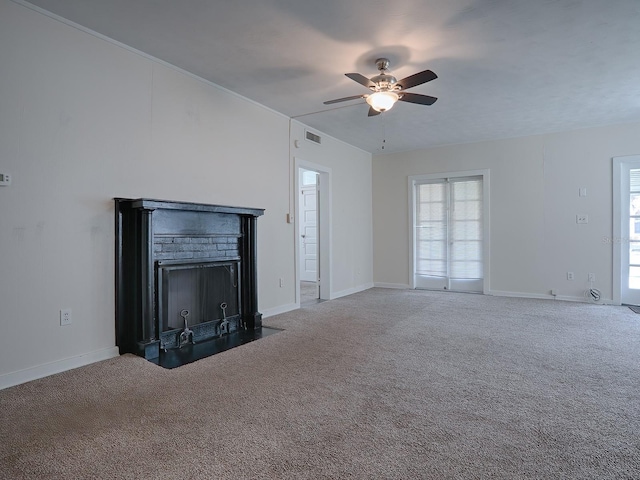 unfurnished living room featuring carpet flooring, ceiling fan, and a fireplace