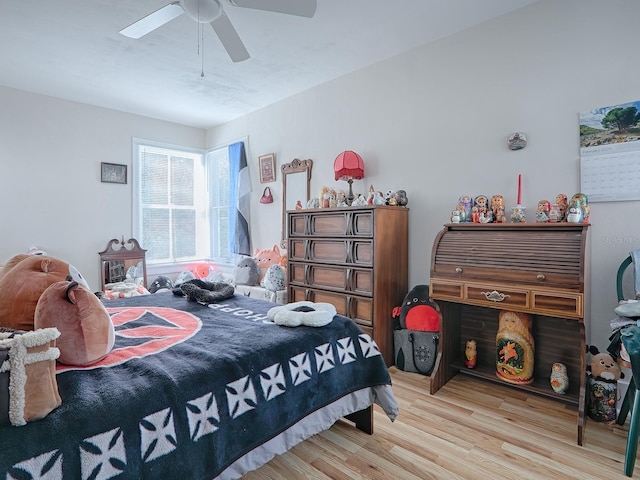 bedroom with ceiling fan and light hardwood / wood-style flooring