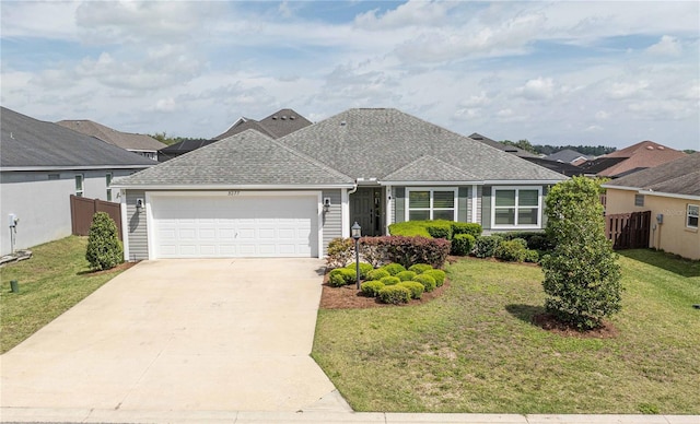 single story home featuring a front yard and a garage