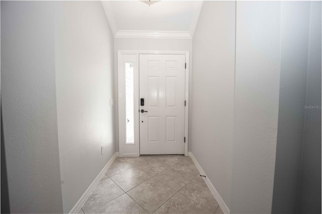 foyer featuring crown molding and light tile flooring