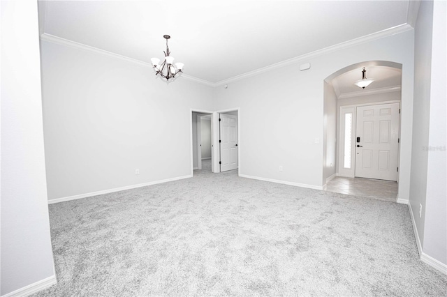 unfurnished room with crown molding, a notable chandelier, and light colored carpet