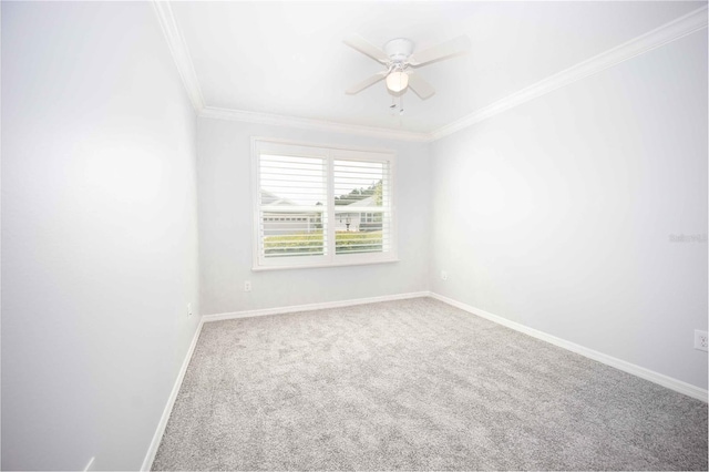 unfurnished room with ceiling fan, ornamental molding, and carpet floors