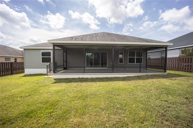 rear view of house featuring a patio, ceiling fan, and a lawn