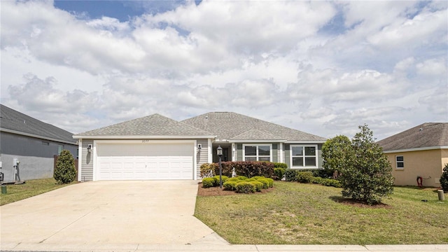 single story home featuring a front yard and a garage