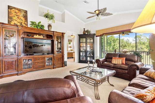 carpeted living room with high vaulted ceiling, ceiling fan, and crown molding