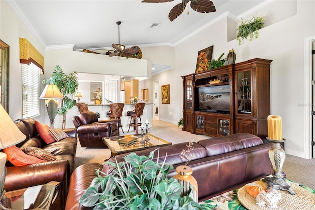 living room with high vaulted ceiling, ceiling fan, crown molding, and light colored carpet