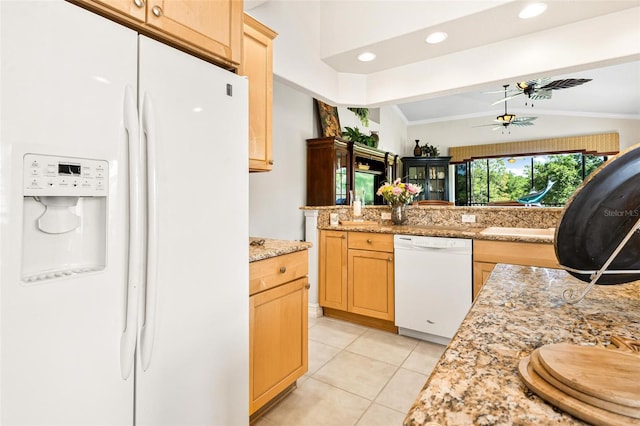 kitchen with light tile floors, white appliances, light stone counters, ceiling fan, and light brown cabinetry