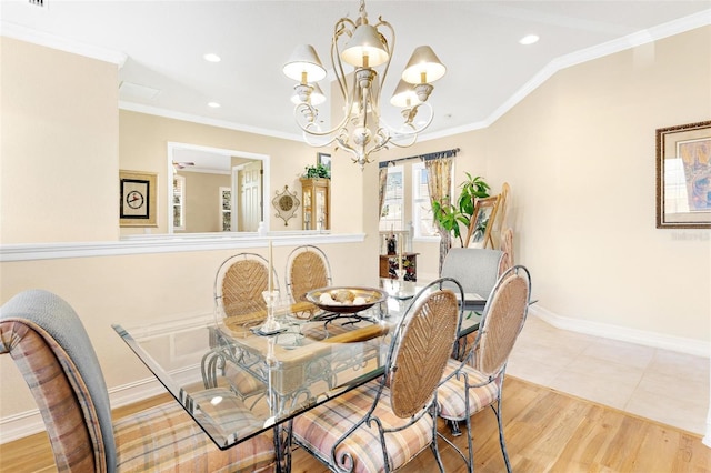 tiled dining space featuring crown molding and an inviting chandelier