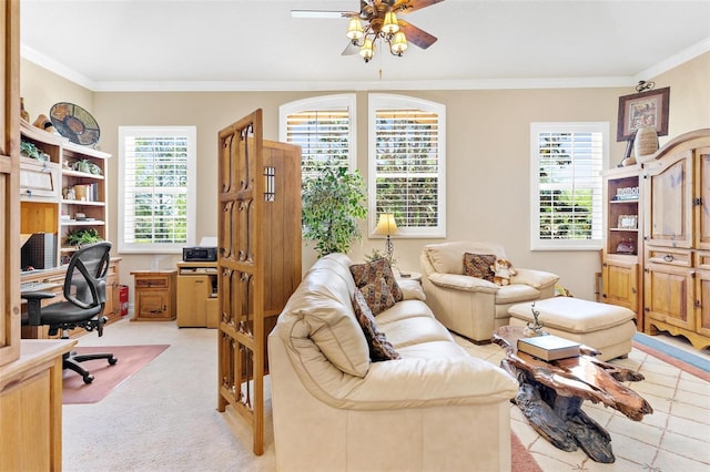 living room featuring ceiling fan, crown molding, and light carpet