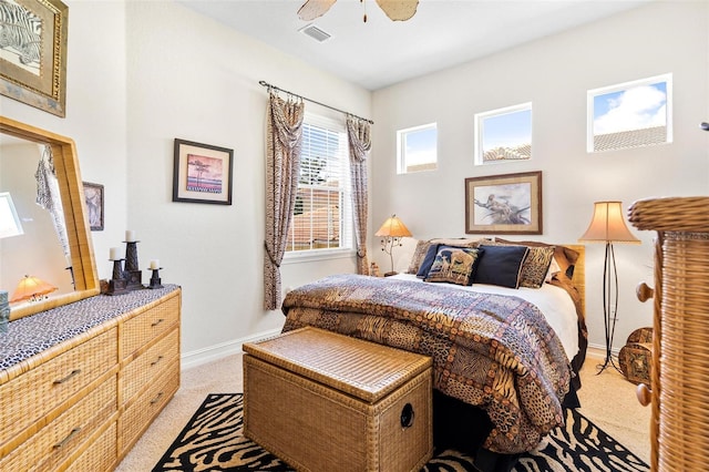 bedroom with ceiling fan and carpet floors