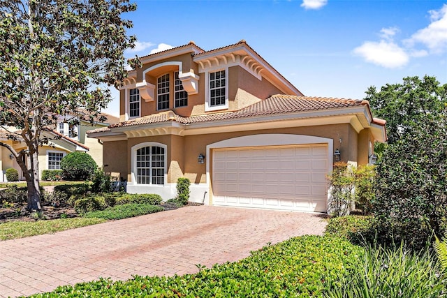 mediterranean / spanish-style house featuring a garage