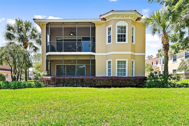 exterior space with a front lawn and a balcony