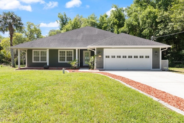 single story home featuring a front lawn and a garage