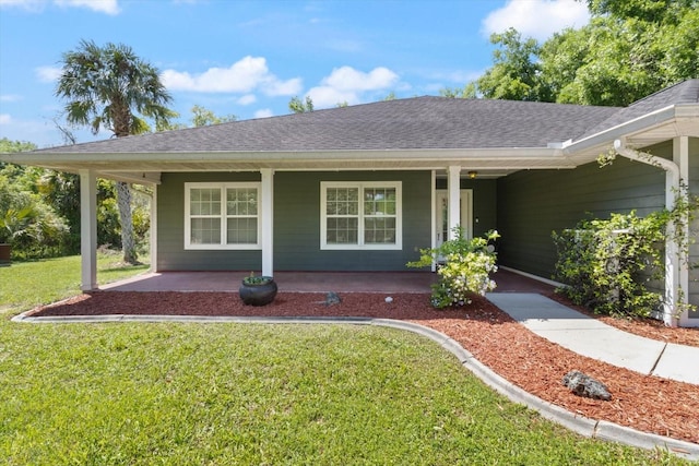 ranch-style home with a front yard and covered porch