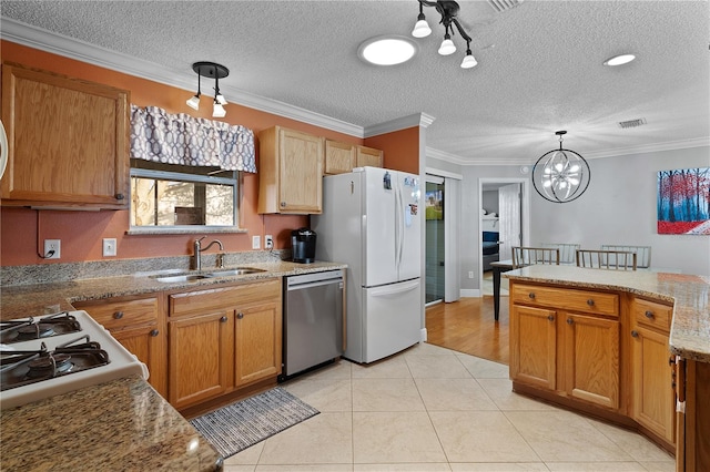 kitchen with hanging light fixtures, sink, light tile floors, a chandelier, and stainless steel dishwasher