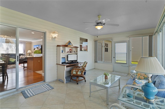 living room featuring ceiling fan and light tile floors