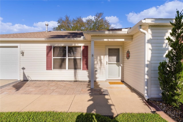 exterior space featuring a patio and a garage