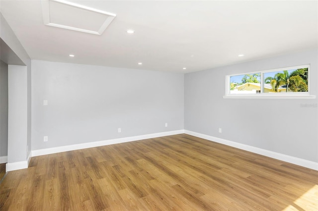 unfurnished room with light wood-type flooring